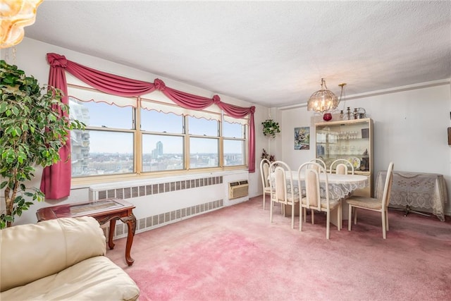 dining area with an inviting chandelier, carpet flooring, radiator, and a textured ceiling