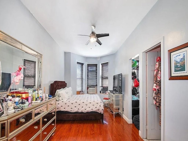 bedroom with hardwood / wood-style flooring and ceiling fan