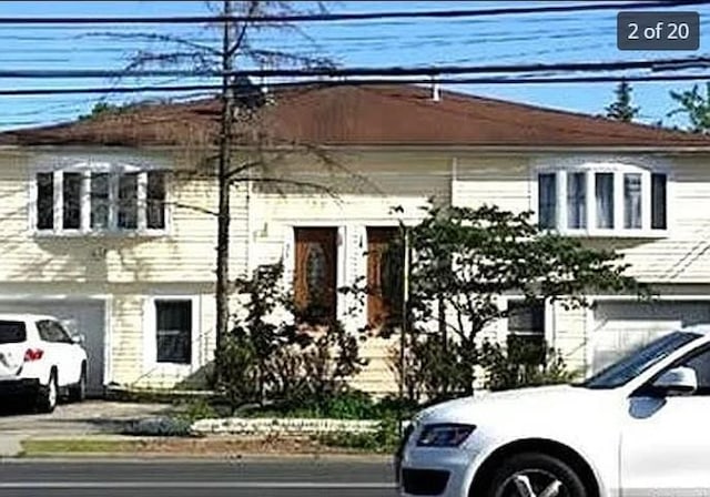 view of front of property featuring a garage