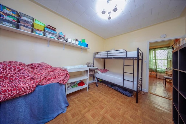 bedroom featuring vaulted ceiling and baseboards