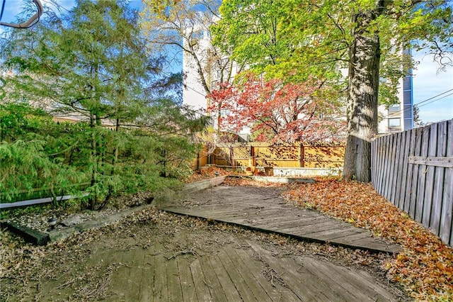 view of yard featuring a wooden deck