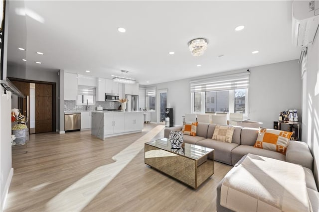 living area featuring recessed lighting and light wood-type flooring