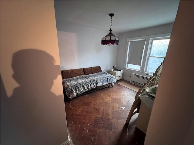 bedroom featuring radiator