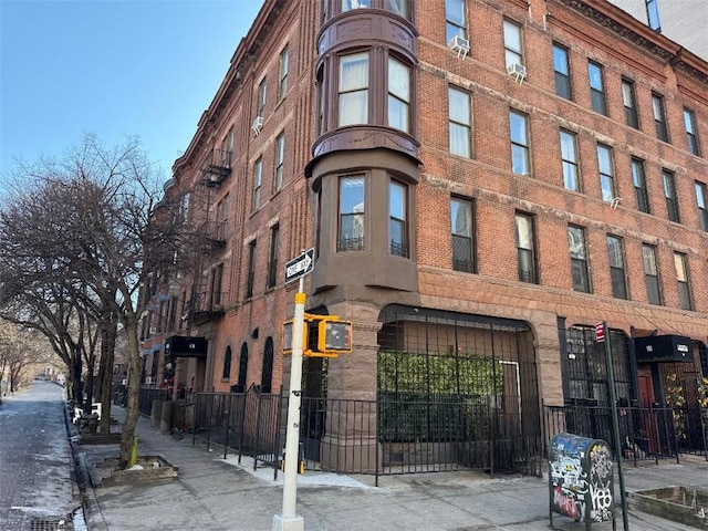 view of building exterior featuring fence