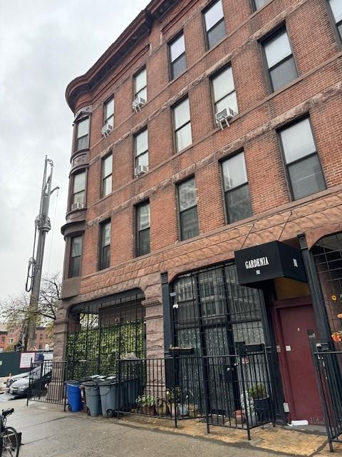 view of building exterior featuring fence