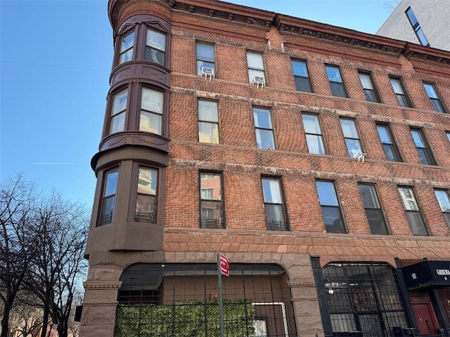 view of building exterior featuring a fenced front yard