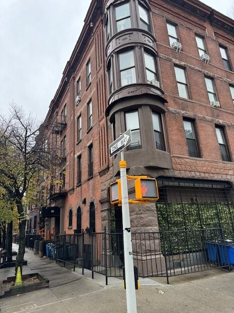 view of building exterior featuring fence