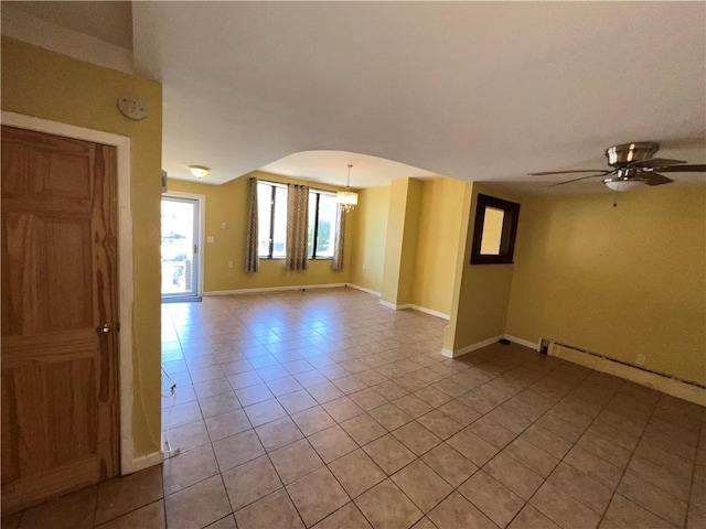 1044 E 96th St, Brooklyn, NY 11236 - empty room featuring light tile patterned floors, baseboards, a baseboard radiator, a chandelier, and ceiling fan