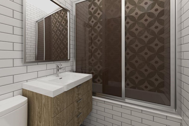 bathroom with tile walls, toilet, vanity, decorative backsplash, and tiled shower