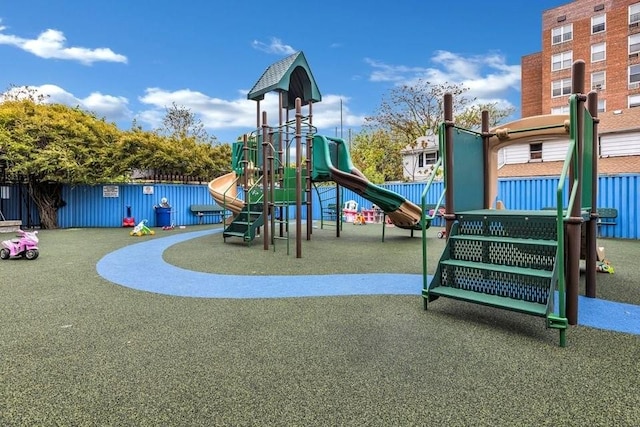 communal playground featuring fence