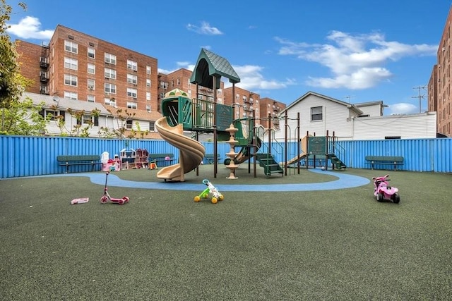 communal playground featuring fence