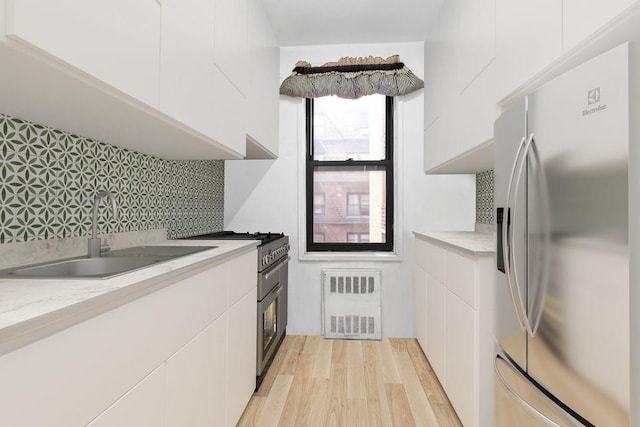 kitchen with visible vents, light countertops, a sink, and appliances with stainless steel finishes