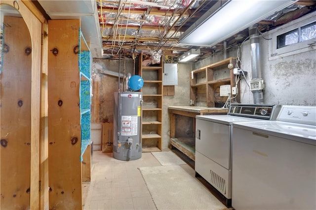 basement with electric panel, gas water heater, and independent washer and dryer