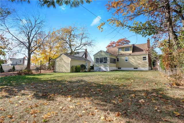 back of house with a yard