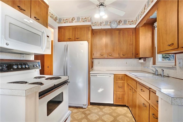 kitchen with ceiling fan, white appliances, and sink