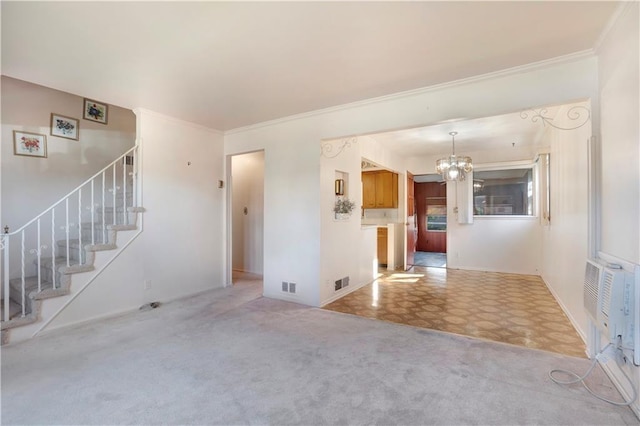 unfurnished living room featuring light colored carpet, an inviting chandelier, and ornamental molding