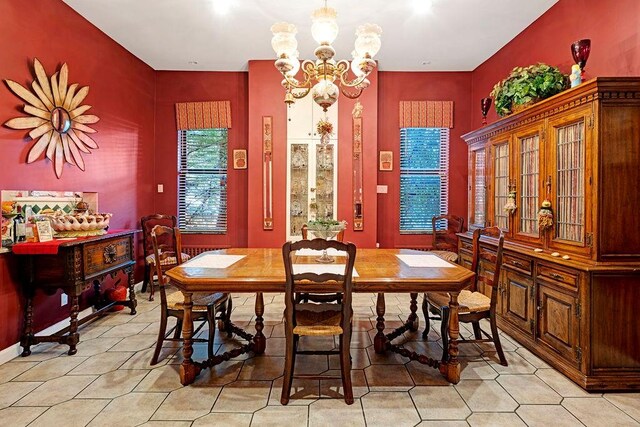 dining space with a chandelier