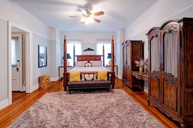 bedroom with ceiling fan and wood-type flooring