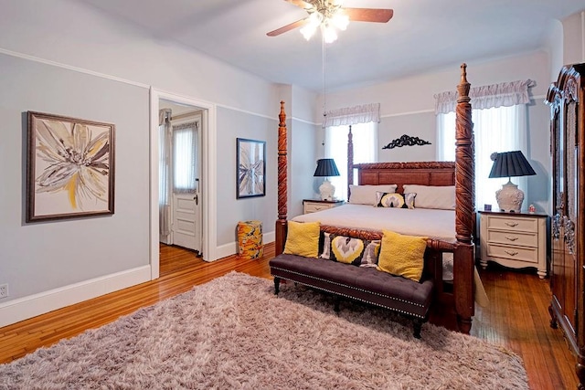 bedroom with hardwood / wood-style flooring and ceiling fan