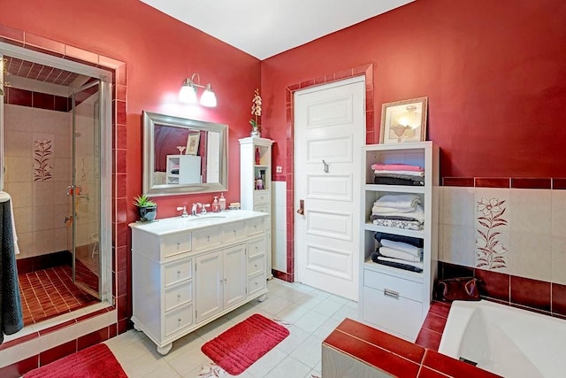 bathroom featuring tile patterned floors, vanity, and plus walk in shower