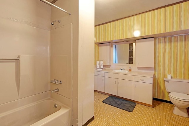 full bathroom featuring toilet, tile patterned floors, vanity, and bathing tub / shower combination