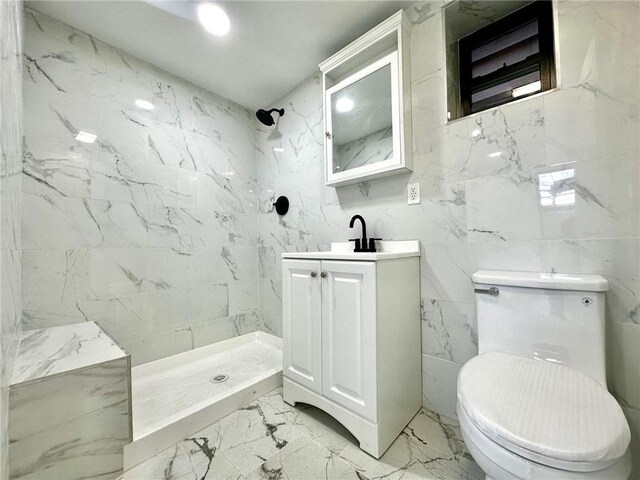 kitchen with sink, a wall unit AC, stainless steel refrigerator, and white cabinets