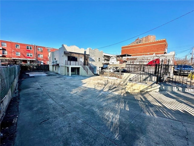 view of community with fence