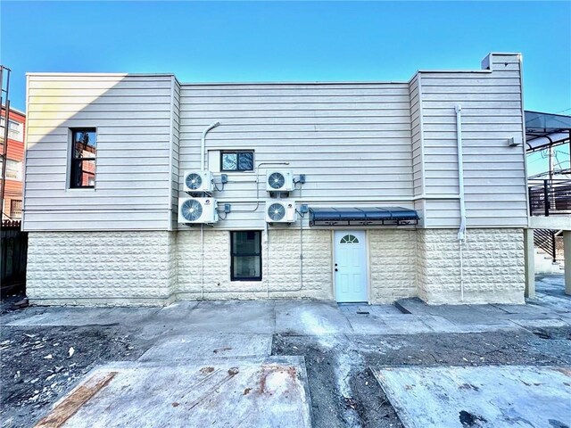 view of front of house with ac unit