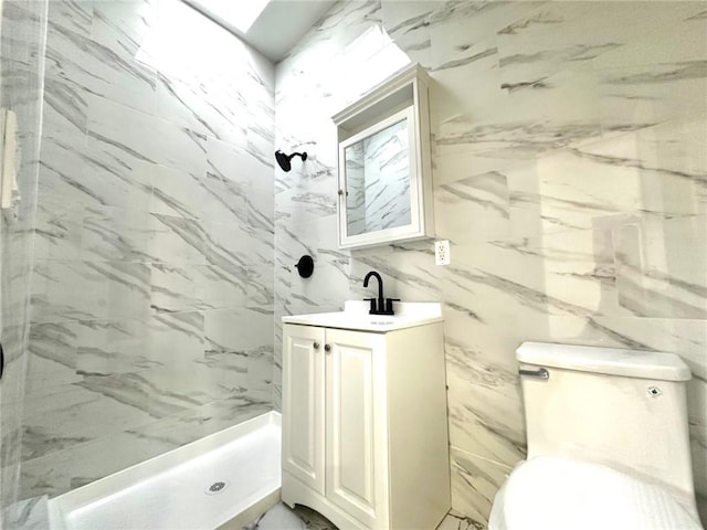 full bathroom with toilet, a shower stall, and vanity