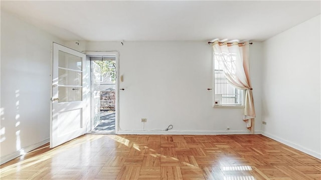 empty room featuring baseboards