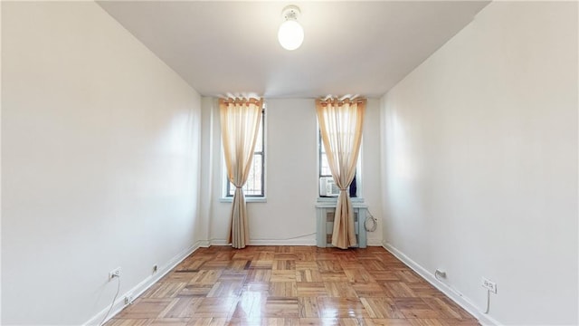 spare room featuring baseboards