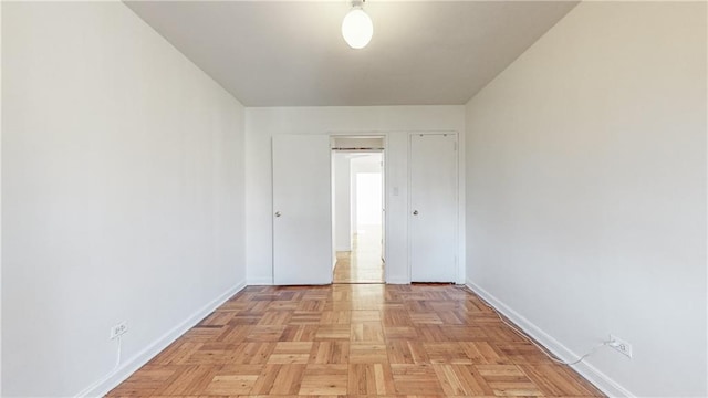 spare room featuring baseboards