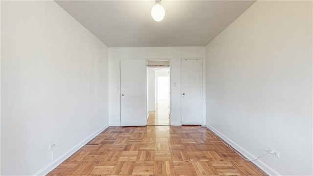 empty room featuring baseboards