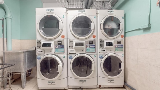 common laundry area featuring washing machine and dryer and stacked washer and dryer