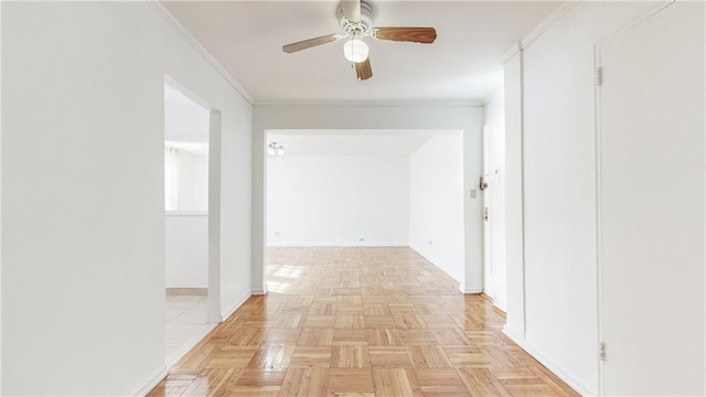 corridor with crown molding and baseboards