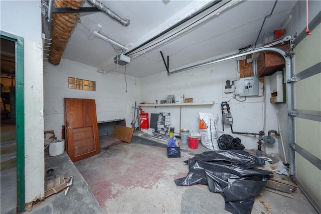 garage with electric panel and a garage door opener