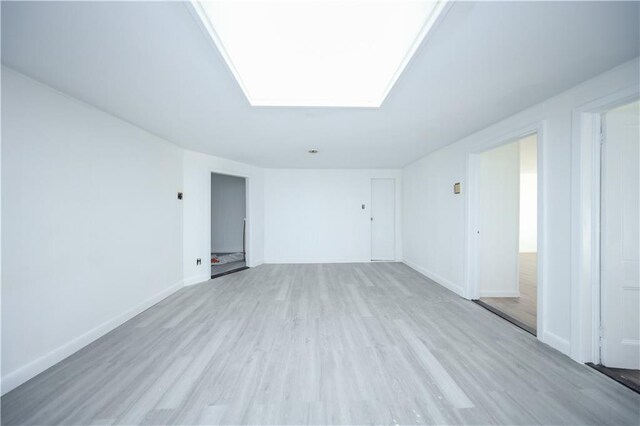 unfurnished room featuring light wood-type flooring