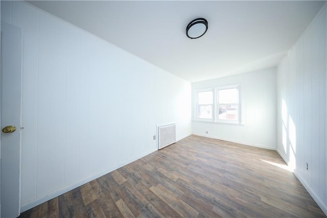 empty room with wood-type flooring