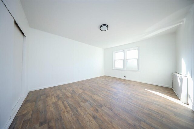 empty room featuring dark hardwood / wood-style floors