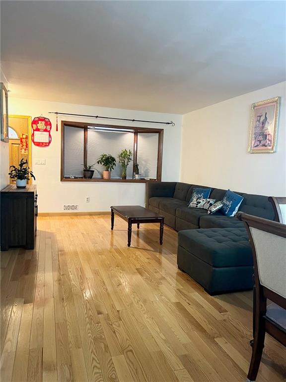 living room with light hardwood / wood-style floors