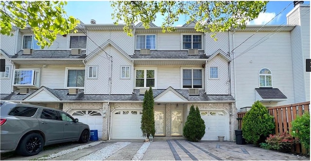 townhome / multi-family property featuring a garage