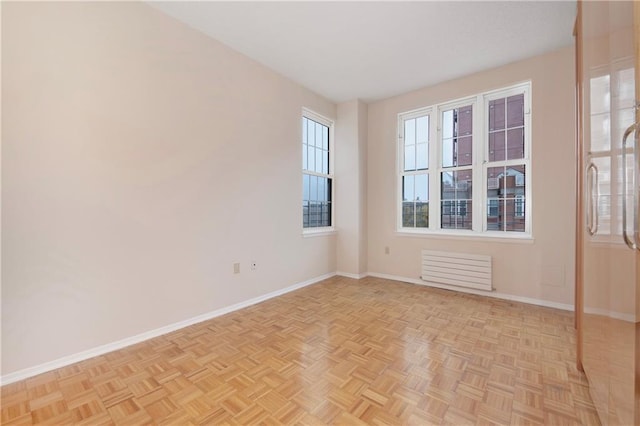 40 Oceana Dr W Unit 5G, Brooklyn, NY 11235 - spare room with baseboards and radiator heating unit