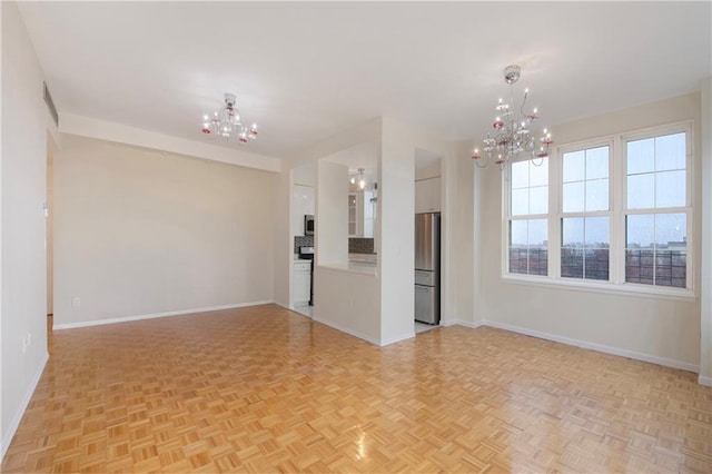 40 Oceana Dr W Unit 5G, Brooklyn, NY 11235 - unfurnished living room featuring a chandelier and baseboards