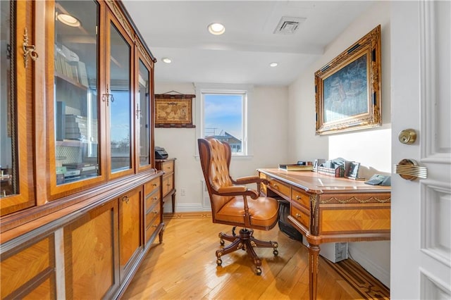 office space with light wood-type flooring