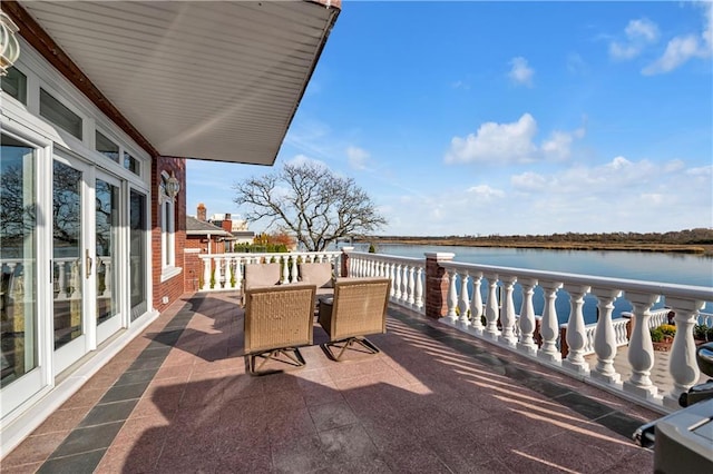 balcony featuring a water view