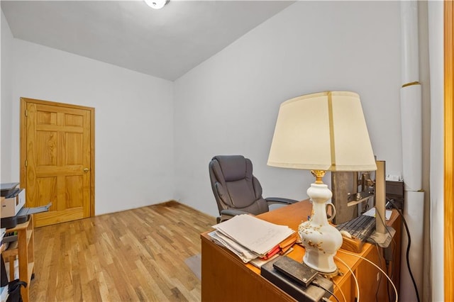 office area with light hardwood / wood-style flooring