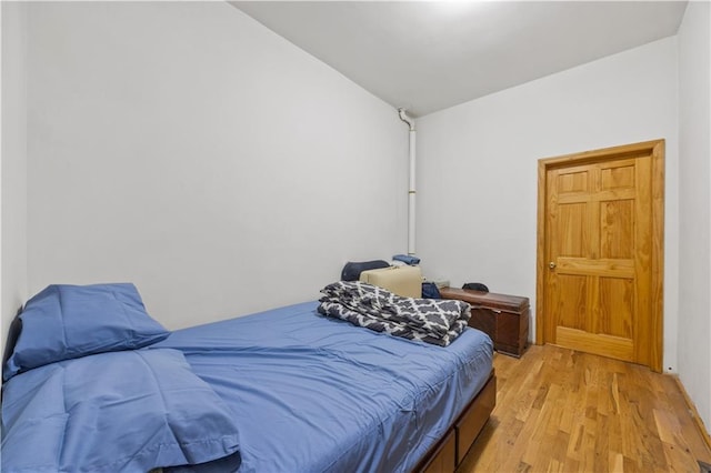 bedroom with light hardwood / wood-style flooring