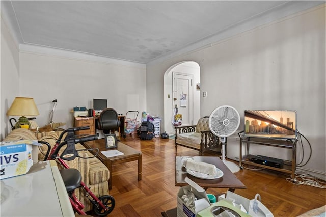 interior space with crown molding and parquet flooring