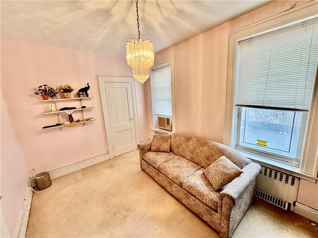 living area featuring radiator, baseboard heating, an inviting chandelier, cooling unit, and carpet floors