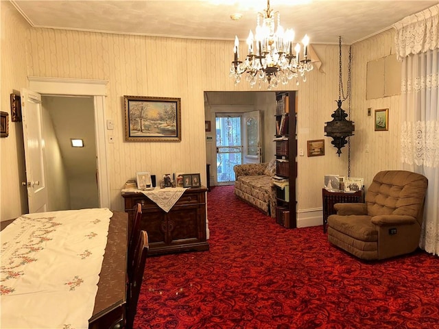 bedroom featuring a notable chandelier, crown molding, and carpet